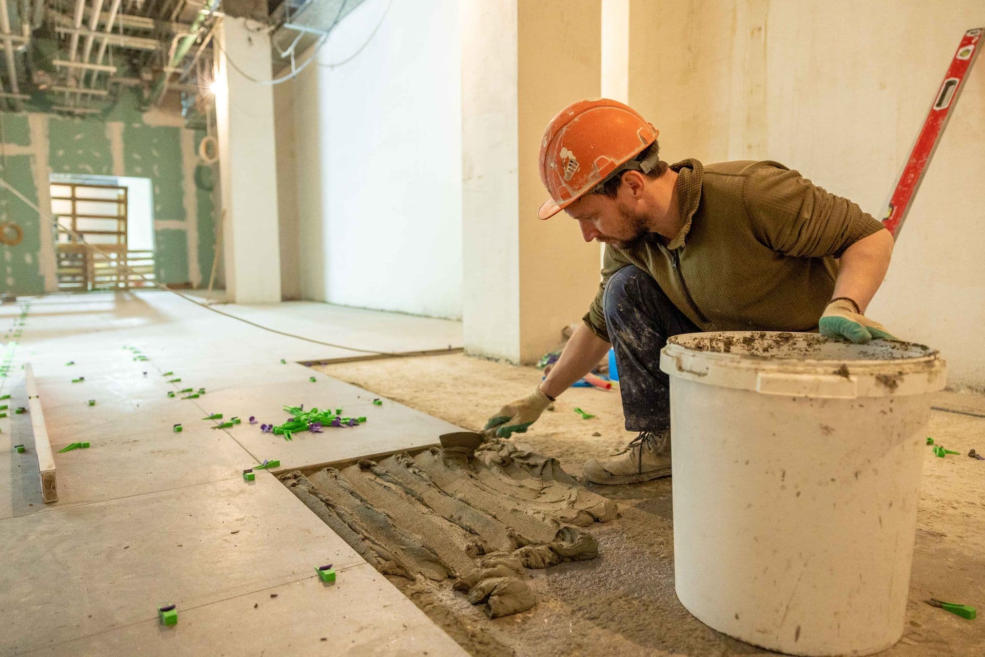 Sydney Quality Tiling craftsman laying tiles on site